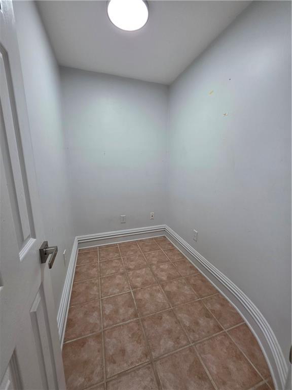 200 Valley Brook Dr, Newnan, GA 30265 - empty room with baseboards and tile patterned floors
