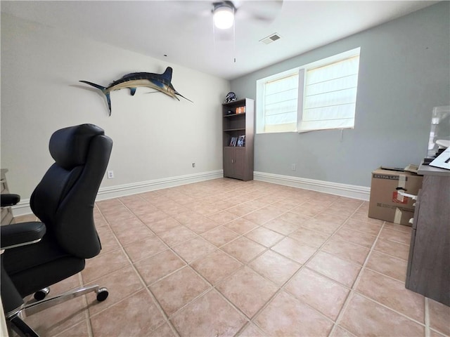 office area featuring light tile patterned floors, visible vents, a ceiling fan, and baseboards