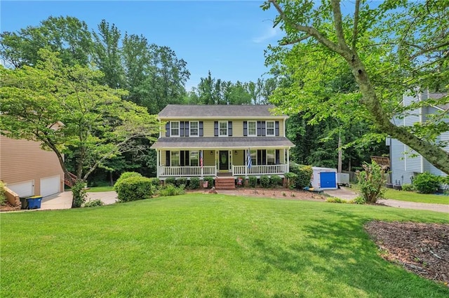 2165 Shillings Chase Dr NW, Kennesaw, GA 30152 - colonial home with covered porch, a front lawn, and a garage