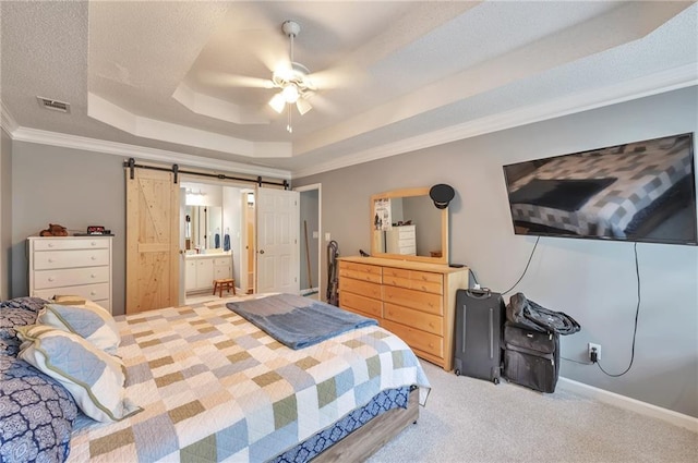2165 Shillings Chase Dr NW, Kennesaw, GA 30152 - bedroom with a tray ceiling, ornamental molding, a barn door, carpet floors, and ceiling fan
