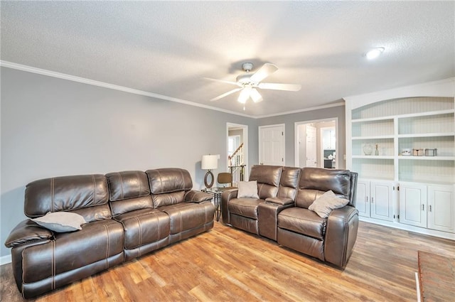 2165 Shillings Chase Dr NW, Kennesaw, GA 30152 - living area with light wood-style floors, ceiling fan, ornamental molding, and a textured ceiling