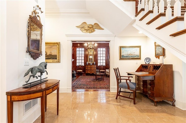 3022 Loridan Way SE, Atlanta, GA 30339 - entryway with baseboards, a chandelier, crown molding, marble finish floors, and vaulted ceiling