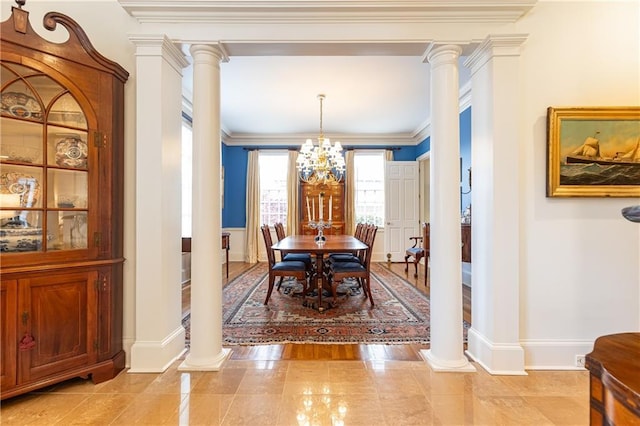 3022 Loridan Way SE, Atlanta, GA 30339 - dining space with ornate columns, a chandelier, baseboards, and crown molding