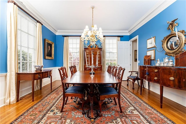 3022 Loridan Way SE, Atlanta, GA 30339 - dining room featuring a chandelier, wood finished floors, plenty of natural light, ornamental molding, and a wainscoted wall