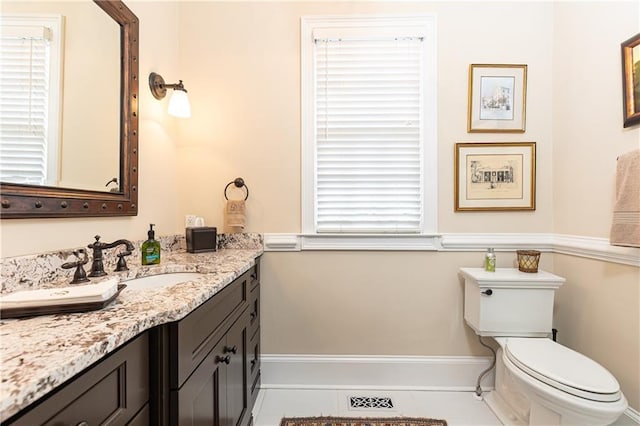 3022 Loridan Way SE, Atlanta, GA 30339 - half bathroom featuring toilet, vanity, tile patterned flooring, and baseboards
