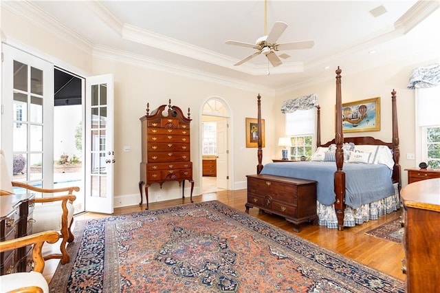 3022 Loridan Way SE, Atlanta, GA 30339 - bedroom with wood finished floors, a tray ceiling, ornamental molding, access to exterior, and a ceiling fan