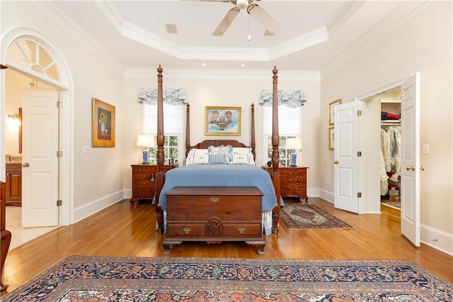 3022 Loridan Way SE, Atlanta, GA 30339 - bedroom with wood finished floors, a tray ceiling, baseboards, and ornamental molding