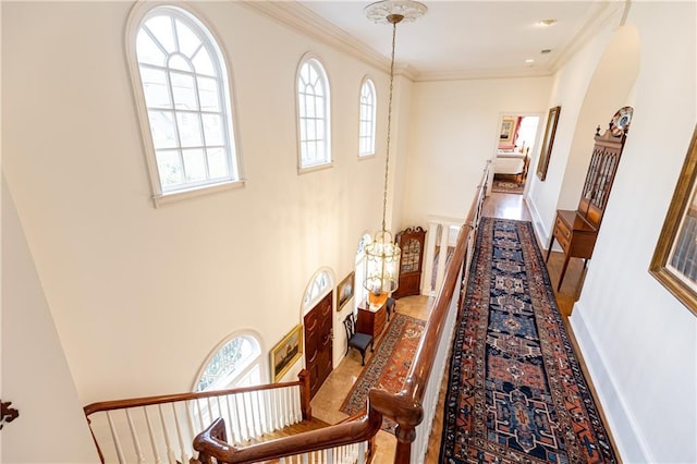 3022 Loridan Way SE, Atlanta, GA 30339 - hall with plenty of natural light, an upstairs landing, a chandelier, ornamental molding, and wood finished floors