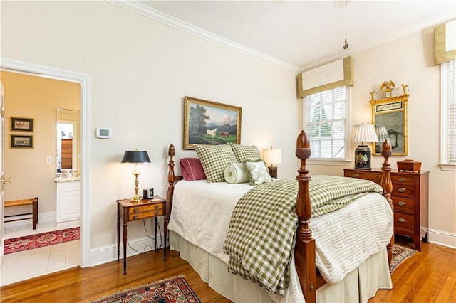 3022 Loridan Way SE, Atlanta, GA 30339 - bedroom featuring crown molding, light wood-type flooring, baseboards, and ensuite bath