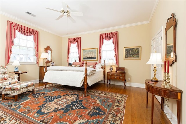 3022 Loridan Way SE, Atlanta, GA 30339 - bedroom featuring wood finished floors, multiple windows, crown molding, baseboards, and ceiling fan