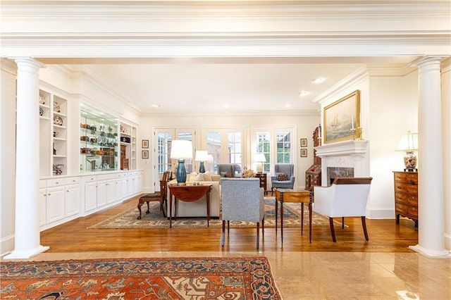 3022 Loridan Way SE, Atlanta, GA 30339 - living room featuring decorative columns, a fireplace, crown molding, baseboards, and wood finished floors