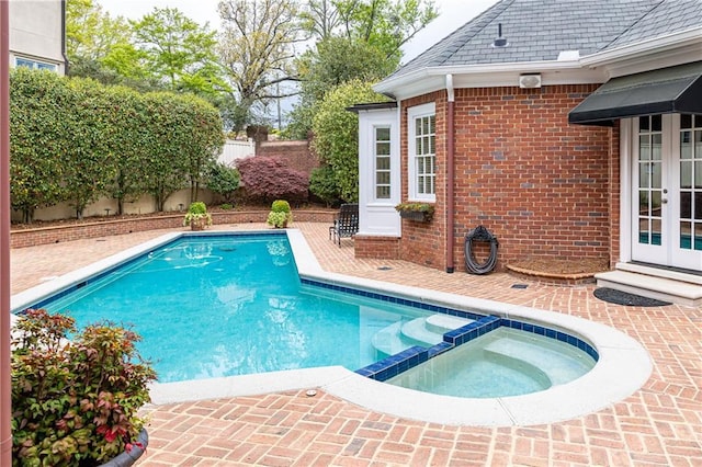 3022 Loridan Way SE, Atlanta, GA 30339 - view of pool with french doors, a pool with connected hot tub, a patio, and a fenced backyard