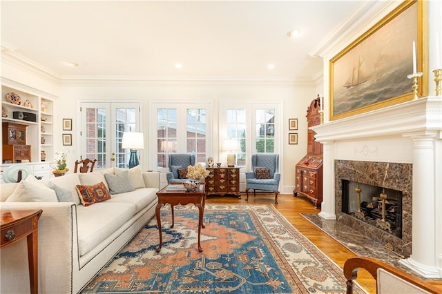 3022 Loridan Way SE, Atlanta, GA 30339 - living room with healthy amount of natural light, ornamental molding, wood finished floors, and a fireplace