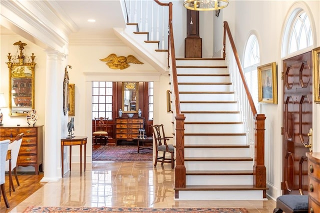 3022 Loridan Way SE, Atlanta, GA 30339 - entryway with stairs, crown molding, ornate columns, and a chandelier