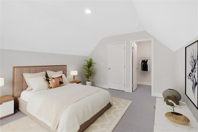 475 Azalea Xing, Dallas, GA 30132 - bedroom featuring lofted ceiling, a walk in closet, carpet flooring, baseboards, and recessed lighting