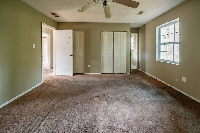 bathroom with tile patterned floors, a shower with door, vanity, and toilet