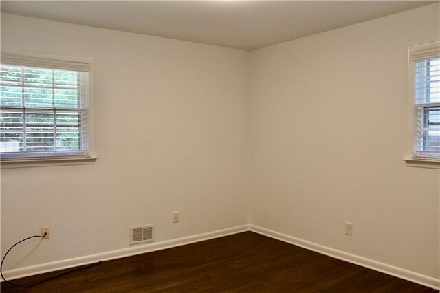1191 Hampton Way NE, Atlanta, GA 30324 - spare room featuring dark wood finished floors and healthy amount of natural light