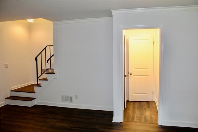 1191 Hampton Way NE, Atlanta, GA 30324 - empty room with wood finished floors, ornamental molding, and stairway