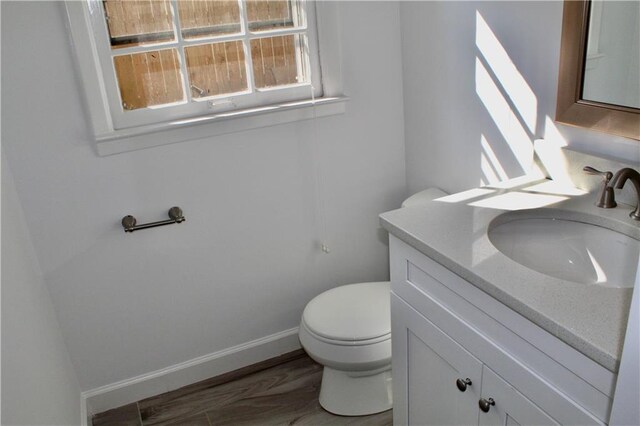 1191 Hampton Way NE, Atlanta, GA 30324 - half bathroom featuring vanity and wood finished floors