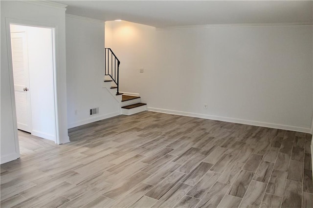 1191 Hampton Way NE, Atlanta, GA 30324 - empty room featuring light wood-type flooring, crown molding, and stairs