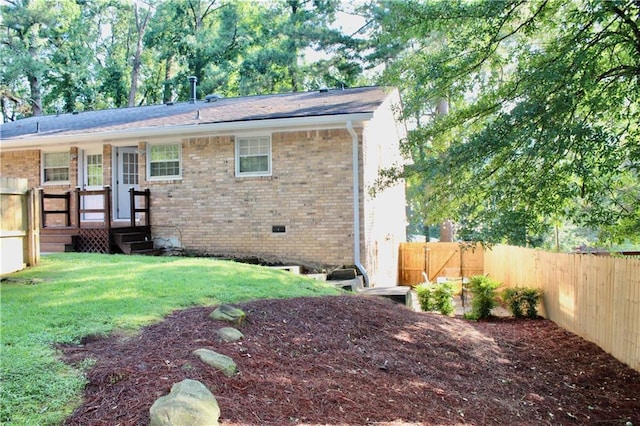 1191 Hampton Way NE, Atlanta, GA 30324 - back of house with a fenced backyard and brick siding