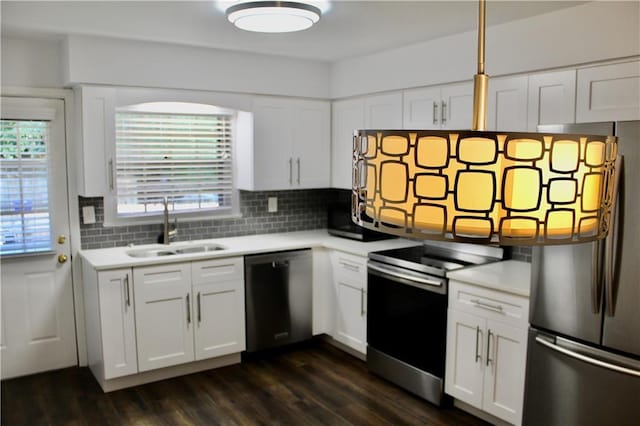 1191 Hampton Way NE, Atlanta, GA 30324 - kitchen featuring stainless steel appliances, light countertops, tasteful backsplash, white cabinetry, and dark wood-type flooring