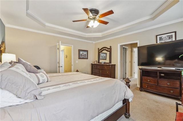 carpeted bedroom featuring ornamental molding, ceiling fan, and a raised ceiling