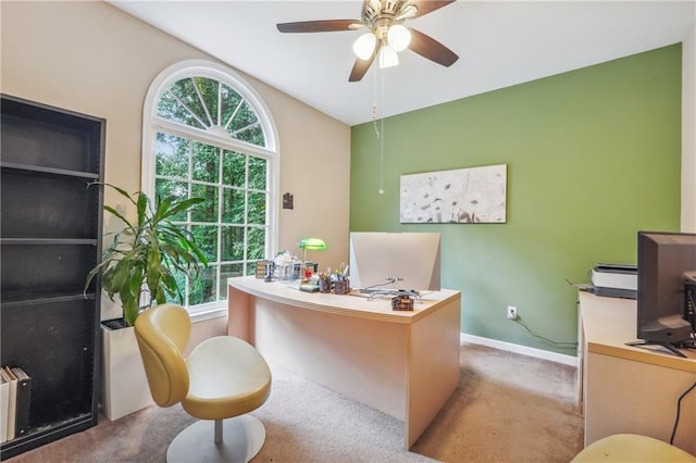 carpeted home office with radiator heating unit and ceiling fan