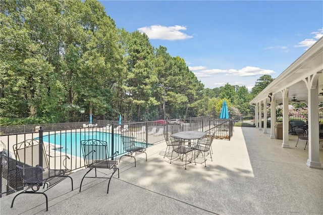 view of swimming pool featuring a patio area