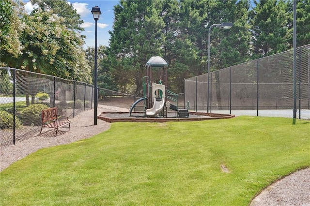 view of playground featuring a lawn