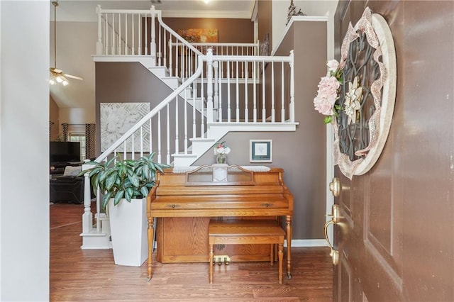 miscellaneous room featuring ceiling fan, hardwood / wood-style floors, and ornamental molding