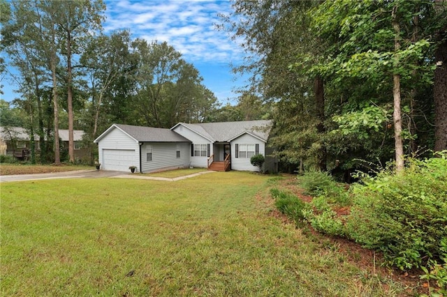 ranch-style home featuring a garage and a front yard