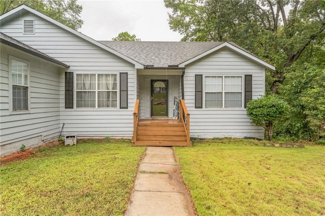 bungalow-style house with a front yard