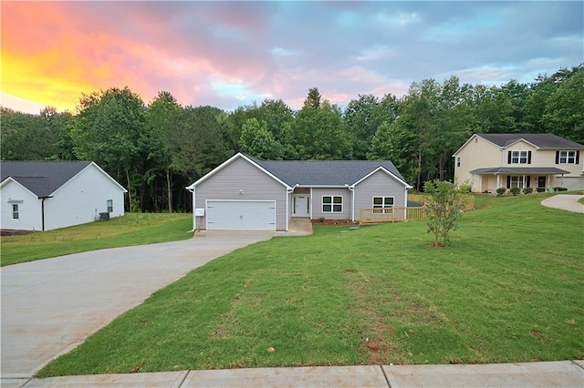 275 Green Commons Dr, Covington, GA 30016 - view of front of property featuring a garage, concrete driveway, and a front lawn