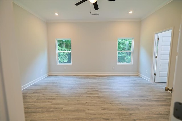 275 Green Commons Dr, Covington, GA 30016 - empty room with crown molding, plenty of natural light, ceiling fan, baseboards, and wood finished floors