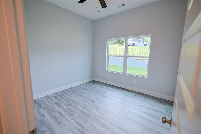 275 Green Commons Dr, Covington, GA 30016 - spare room with wood finished floors, a ceiling fan, and baseboards