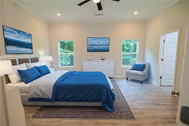 275 Green Commons Dr, Covington, GA 30016 - bedroom with multiple windows, crown molding, wood finished floors, baseboards, and recessed lighting