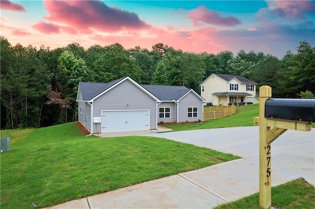 275 Green Commons Dr, Covington, GA 30016 - view of front of home featuring a front yard, driveway, and an attached garage