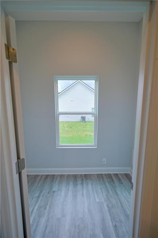 275 Green Commons Dr, Covington, GA 30016 - empty room with wood finished floors and baseboards