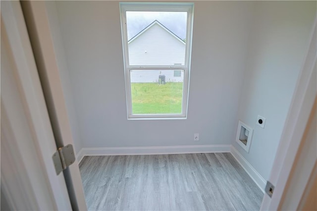 275 Green Commons Dr, Covington, GA 30016 - spare room with light wood finished floors, healthy amount of natural light, and baseboards