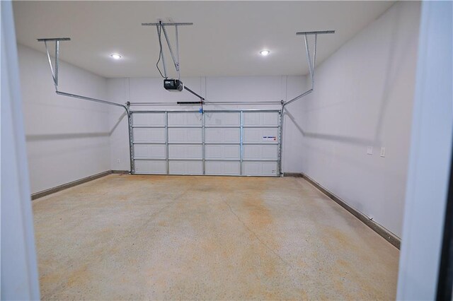 275 Green Commons Dr, Covington, GA 30016 - garage featuring a garage door opener, recessed lighting, and baseboards
