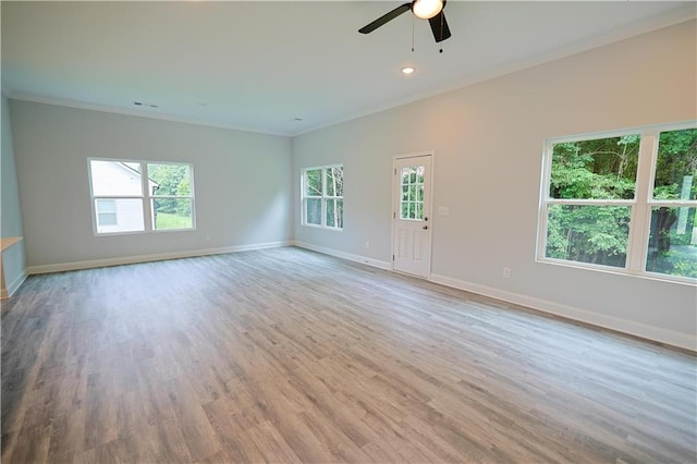 275 Green Commons Dr, Covington, GA 30016 - empty room with ornamental molding, a ceiling fan, baseboards, wood finished floors, and recessed lighting