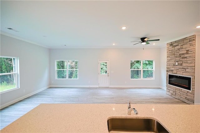 275 Green Commons Dr, Covington, GA 30016 - kitchen with open floor plan, a sink, plenty of natural light, crown molding, and recessed lighting
