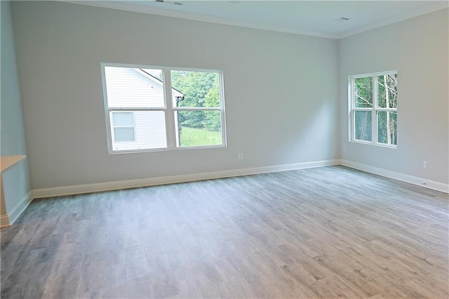 275 Green Commons Dr, Covington, GA 30016 - spare room featuring ornamental molding, wood finished floors, and baseboards