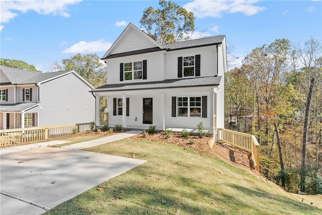 view of property with covered porch and a front yard