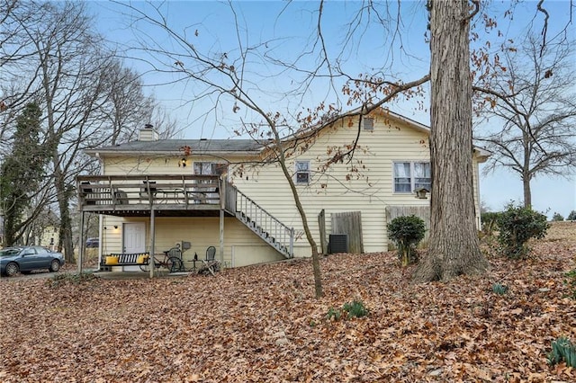 back of house with a wooden deck