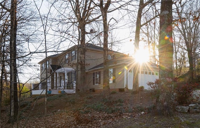 view of front of property with a garage and a chimney