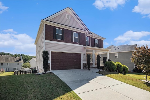 view of front facade featuring a front yard and a garage