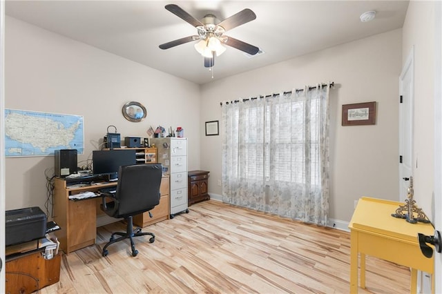 office space featuring light hardwood / wood-style floors and ceiling fan