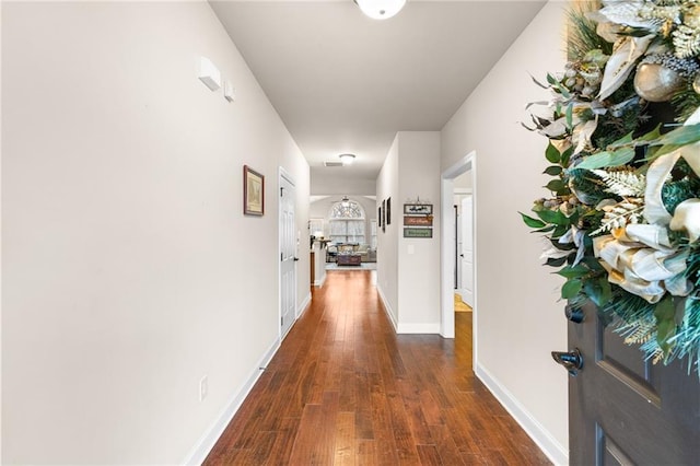 corridor featuring dark hardwood / wood-style flooring